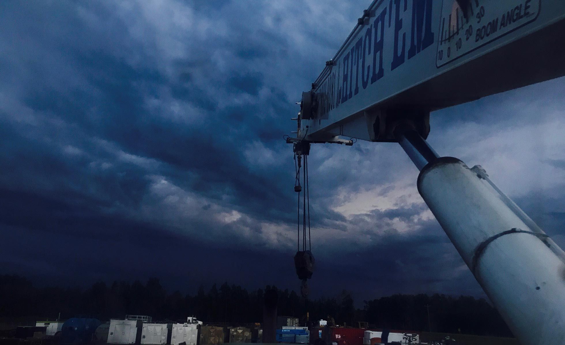 Hitch'em picker at dusk on a Montney lease