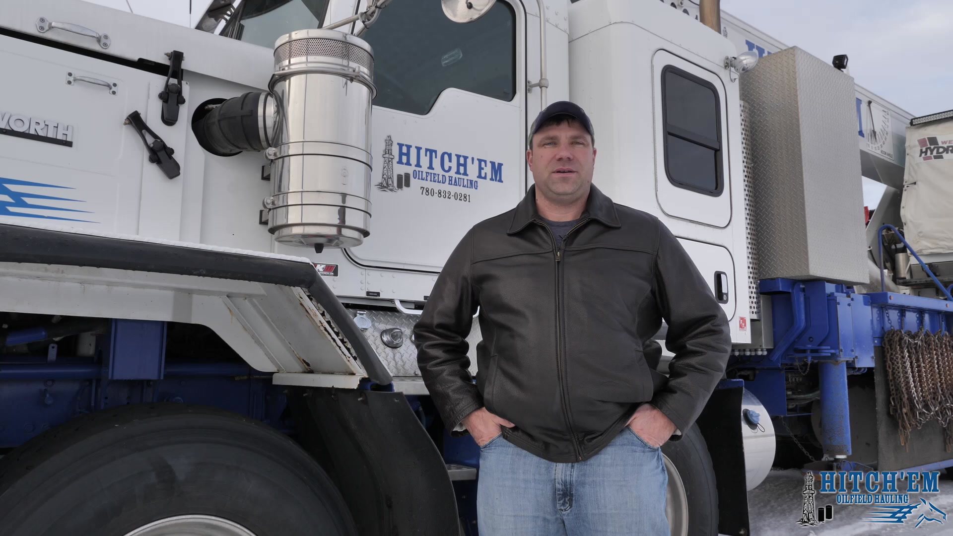 Mitch Sutherland in front of a branded Hitch'em Kenworth winch tractor